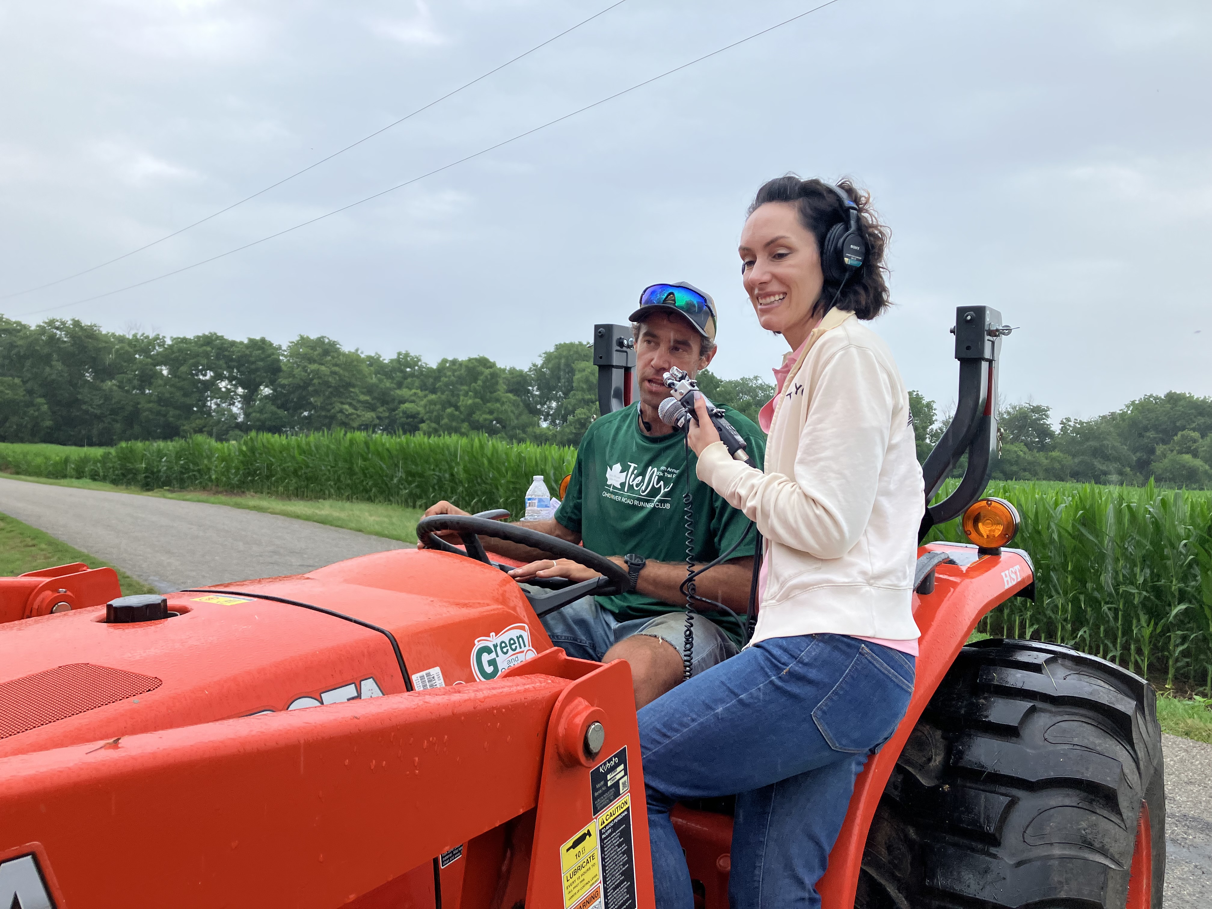 Tracy Wholf interviewing a farmer on a tractor for ABC News Start Here podcast