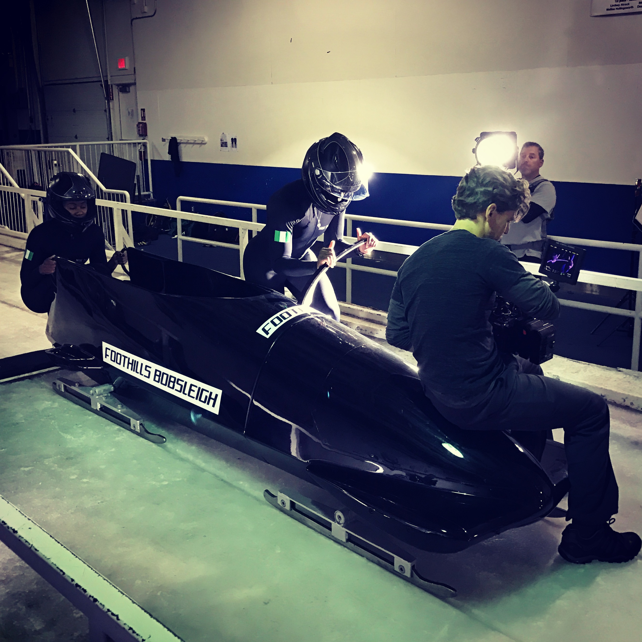 Tracy Wholf filming the Nigerian bobsled team on the ice for ESPN E:60